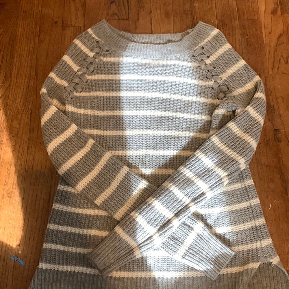 A grey and white sweater